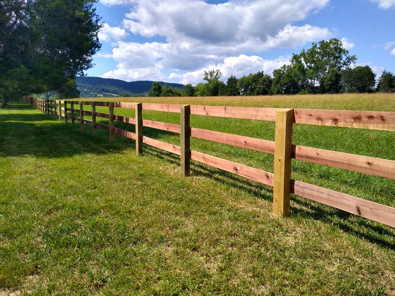 The Virginia Fence Company Wood Board Fencing